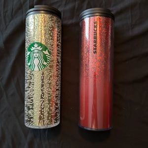Two plastic Starbucks cups